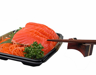 Image showing Salmon sashimi and chopsticks