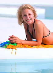 Image showing Young woman in the pool 