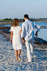 Image showing Young couple walking on beach