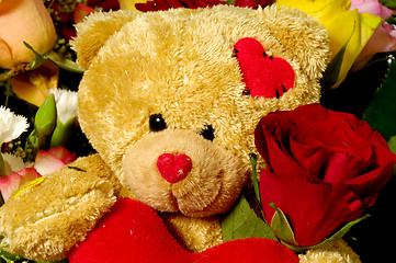 Image showing Teddy bear and roses