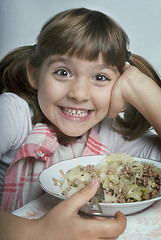 Image showing Girl enjoying her lunch