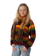 Image showing Young woman wearing a sweater holding hands in pockets