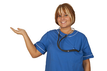 Image showing Beautiful nurse holding something