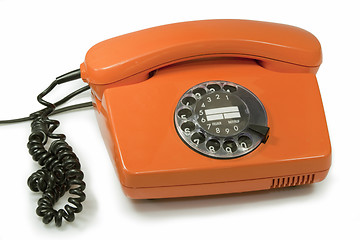 Image showing Old orange telephone 