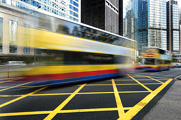 Image showing Bus speeding through the street