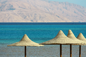 Image showing Umbrellas, Mount and Red Sea