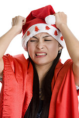 Image showing disappointed woman with santa claus hat