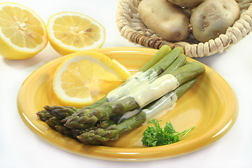Image showing green asparagus with Hollandaise sauce