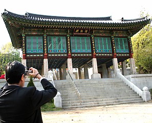 Image showing Businessman stops for a photo