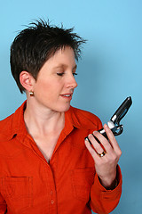 Image showing Woman holding her phone