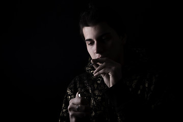 Image showing portrait of a young man with cigarette 