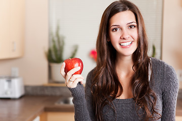 Image showing Woman holding apple