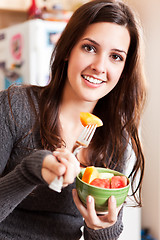 Image showing Woman holding a fruit bowl