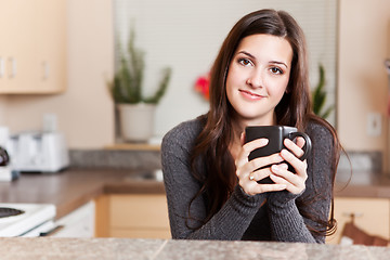 Image showing Woman holding coffee cup