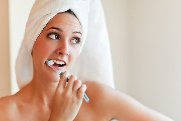 Image showing Woman brushing teeth