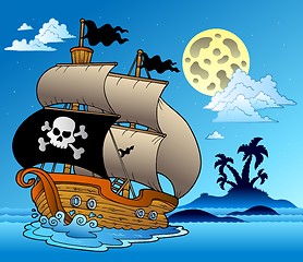 Image showing Pirate sailboat with island silhouette