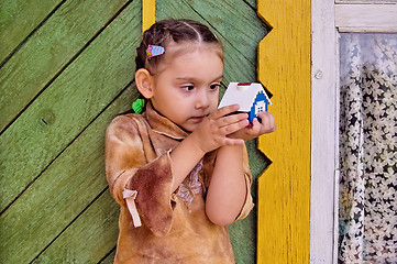 Image showing Girl with toy house