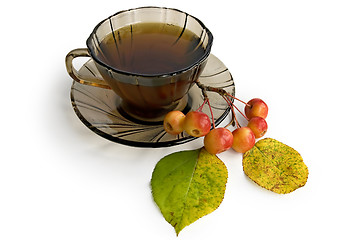 Image showing Tea in a brown glass bowl with apples