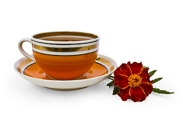 Image showing Tea in a cup of orange marigolds