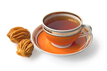 Image showing Tea in an orange cup with nath