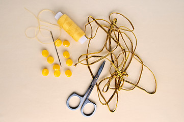 Image showing Yellow fittings on the fabric