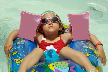 Image showing Child in pool relaxing