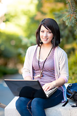 Image showing Mixed race college student with laptop