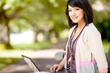 Image showing Mixed race college student with laptop