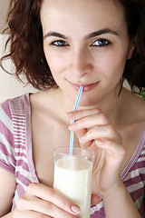 Image showing Young people eating milk with cereals