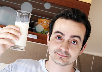 Image showing Young people eating milk with cereals