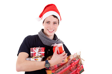 Image showing Happy christmas young man with a gifts, isolated on white background