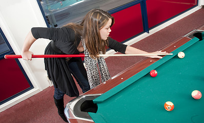 Image showing Woman playing pool