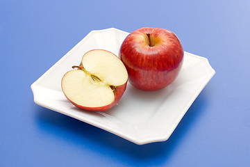 Image showing Half and whole apple