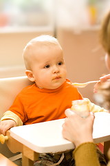 Image showing Feeding a little baby boy