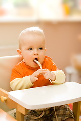 Image showing Baby boy playing with spoon