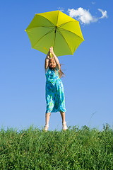 Image showing Girl at meadow with umbrella