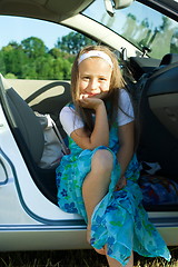 Image showing Girl sitting in car