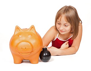 Image showing Little girl exploding piggy bank