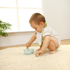 Image showing Baby boy eating