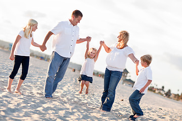 Image showing Adorable Little Girl Swinging with Her Parents