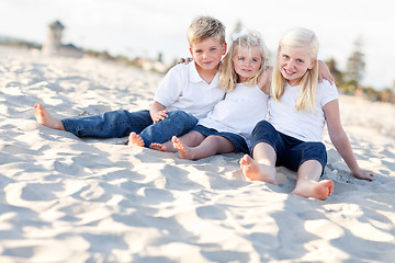 Image showing Adorable Sisters and Brother Having Fun at the Beach
