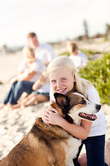 Image showing Cute Girl Playing with Her Dog Outside