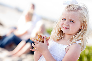 Image showing Adorable Little Blonde Girl with Starfish