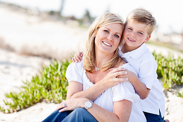 Image showing Cute Son Hugs His Mom at The Beach