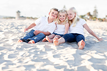 Image showing Adorable Sisters and Brother Having Fun at the Beach