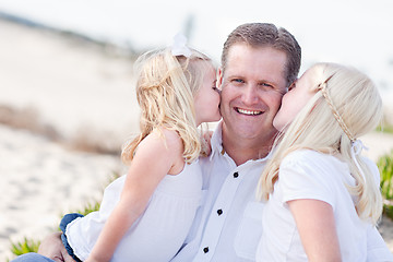 Image showing Handsome Dad Getting Kisses from His Cute Daughters 