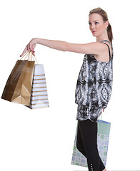 Image showing young woman shopping on white