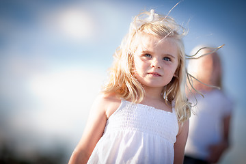 Image showing Adorable Blue Eyed Girl Playing Outside