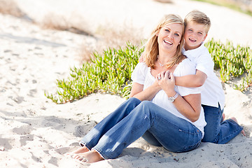 Image showing Cute Son Hugs His Mom at The Beach