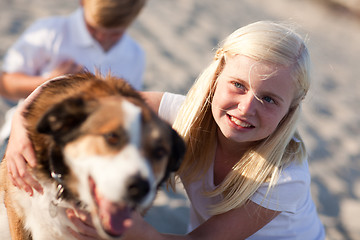 Image showing Cure Girl Playing with Her Dog